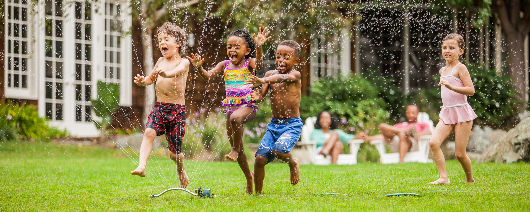 TruGreen.com homepage hero banner from January 2016: children playing in a sprinkler, no online buying flow